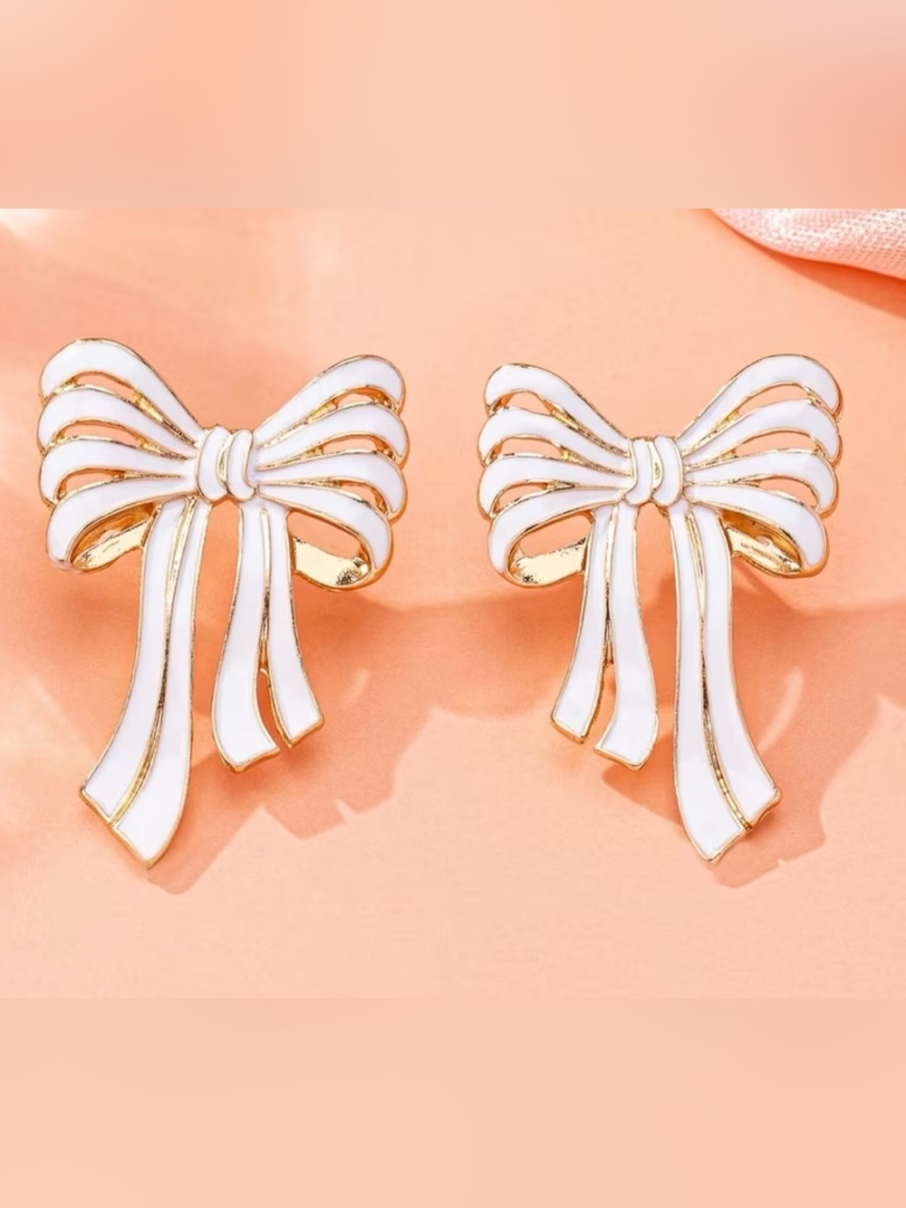 White Enamel Bow Earrings with Gold Trim